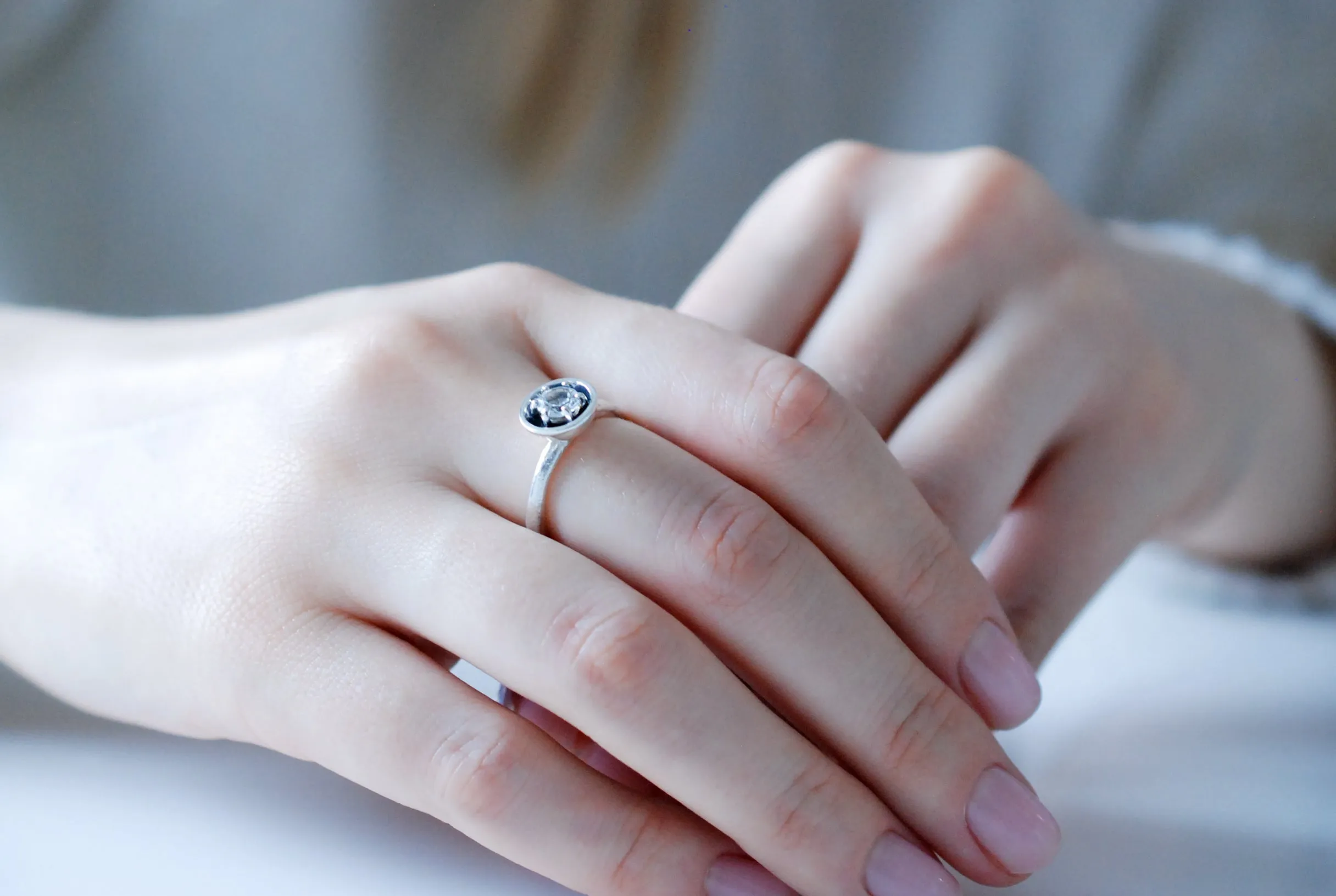 Silver engagement ring with clear white topaz