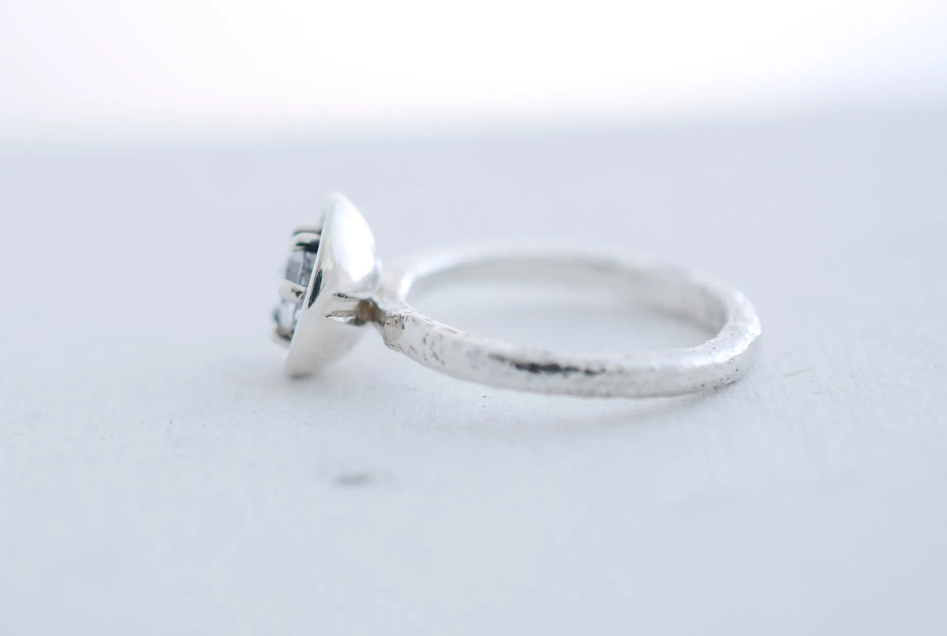 Silver engagement ring with clear white topaz