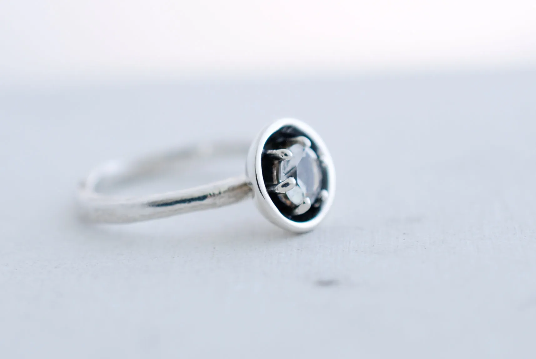 Silver engagement ring with clear white topaz
